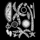 A set of white plastic or metal craft cutters or stencils featuring various beach and marine motifs, including a palm tree, seashell, starfish, anchor, and seashell, arranged on a solid black background.