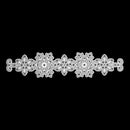 A white lace applique trim featuring three ornate snowflake-like motifs connected by delicate scalloped edges, shown against a solid black background.