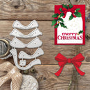 A Christmas-themed flat lay on a rustic wooden surface showing a metal holiday tree-shaped die cutout alongside a red Christmas card with holly and a red bow, plus a red bow graphic and decorative props.
