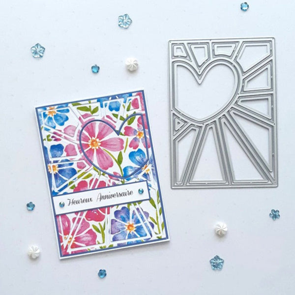 A handmade floral anniversary card with a heart motif and a silver metal die cut sheet, displayed on a white background with scattered decorative confetti.