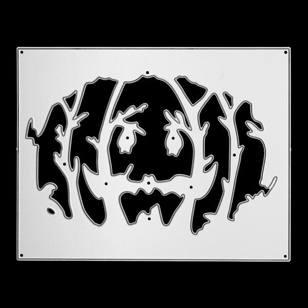 A rectangular metal cutting or stamping template with a black Halloween jack-o'-lantern face design, shown against a solid black background.