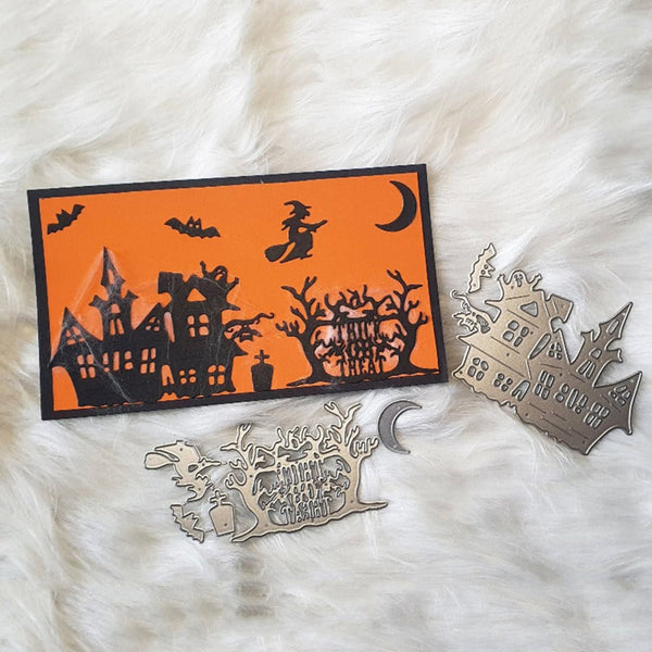 Halloween-themed laser-cut metal ornaments displayed on a white faux fur background, including an orange and black haunted house silhouette card and silver-toned metal pieces with spooky designs and text.