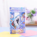 A decorative layered paper card with an underwater theme, featuring blue and white watercolor textures, stickers of a dolphin, octopus, whale, jellyfish, and fish, and a bottle-shaped element with a cork and tag.