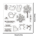 A sheet of clear acrylic or rubber stamps with black line-art designs and phrases, shown on a white background with dimension markers reading 14cm/5.1in on both width and height.