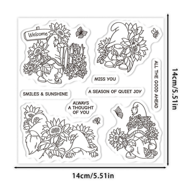 A sheet of four clear stamp designs featuring black line art illustrations of gnomes, sunflowers, butterflies, and decorative text, shown with dimension markers of 14cm/5.1in on a white background.