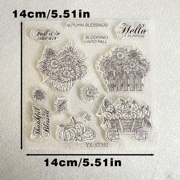 Clear stamp sheet with autumn-themed designs including sunflowers, pumpkins, a wagon full of pumpkins, and phrases like 'Autumn Blessings' and 'Hello Pumpkin' on a textured white background with dimension markers showing 14cm/5.51in.