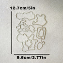 A set of metal die-cut craft templates arranged on a textured off-white background, with black measurement lines and text indicating dimensions of 12.7cm/5in vertically and 9.