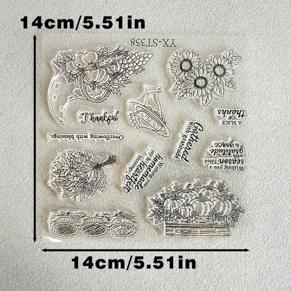 Clear acrylic stamp set with autumn and harvest-themed designs including pumpkins, sunflowers, leaves, and phrases like 'Thankful' and 'Gathered', shown on a light background with printed dimension lines and text indicating 14cm/5.51in.