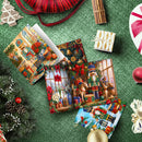 A styled flat-lay of Christmas-themed wrapping paper sheets spread out on a green textured surface, surrounded by holiday decorations including pine branches, ornaments, a red ribbon spool, cinnamon sticks, and a small wrapped gift box.