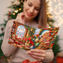 A woman in a beige sweater holds an open Christmas card featuring a gingerbread man and festive holiday decorations, with a blurred Christmas tree and warm string lights in the background.