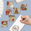 A hand is writing in a floral 'Best Wishes' card, surrounded by six small square Christmas-themed cards or prints with festive illustrations like Santa, snowman, candy canes, ornaments, and a tree. The scene is styled on a light blue background with partial props visible at the edges.