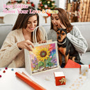 A woman presents a colorful diamond painting gift bag featuring a sunflower design, while another woman holds a small black and tan dog on a couch in a cozy living room setting. The text overlay reads 'Best Giftto Show Your Love & Care'.