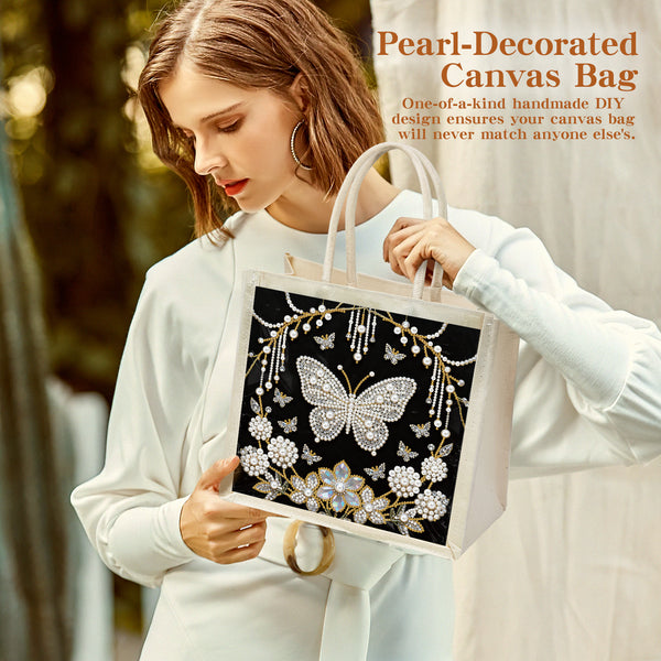 Woman holding a pearl-decorated canvas bag with butterfly design