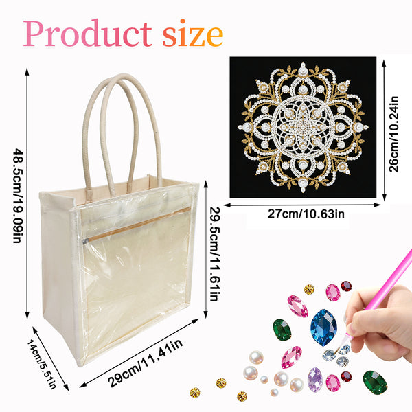 A clear plastic tote bag with cream handles and trim, shown with overlaid product size measurements. A small inset shows a decorative jeweled mandala-style embellishment on a black background, and a hand is shown placing colorful faux gems into the bag.