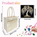 A clear plastic tote bag with beige handles and a beige zipper trim, shown with product size measurements. A black inset shows a rhinestone tree embellishment, and a hand is shown placing colorful rhinestones into the bag.