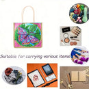 A tote bag with a colorful butterfly and leaf print on the front, shown in a collage layout with various lifestyle and styling props around it. The text on the image reads 'Suitable for carrying various items'.