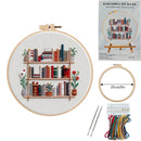 Embroidery DIY art kit with completed embroidery of a bookshelf and accessories on a white background.