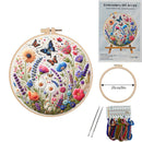 Embroidery DIY art kit with floral design, tools, and packaging on a white background