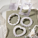 Decorative lace frames on a textured surface with a white background