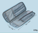 An open gray zippered organizer case with multiple interior pockets and compartments, shown on a light blue background with dimension arrows and text indicating 15cm by 39cm (5.90in by 15.
