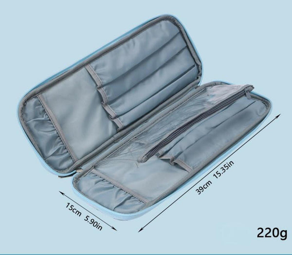An open gray zippered organizer case with multiple interior pockets and compartments, shown on a light blue background with dimension arrows and text indicating 15cm by 39cm (5.90in by 15.