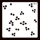 A square white card or stencil with rounded corners, featuring scattered small black circular dot clusters and the printed text '2-1' in the top-right corner, set against a dark brown background.