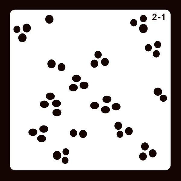 A square white card or stencil with rounded corners, featuring scattered small black circular dot clusters and the printed text '2-1' in the top-right corner, set against a dark brown background.