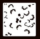 A white square stencil template with rounded corners on a dark brown background, featuring multiple irregular black leaf-like cutouts and the text '5-3' in the top-left corner.