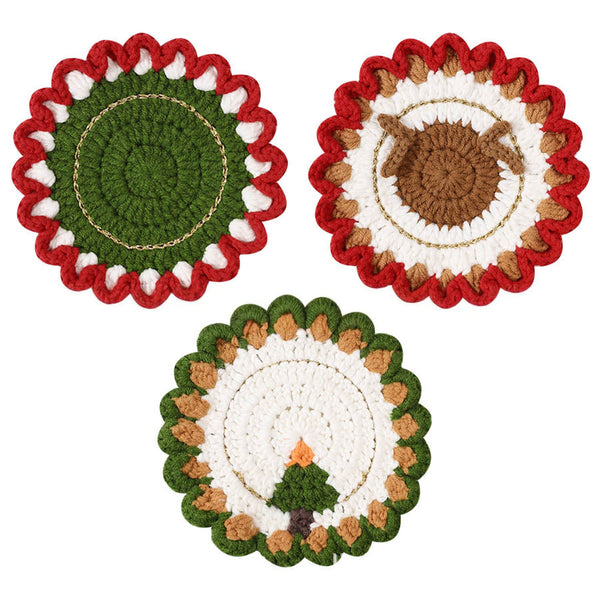 Three round crocheted coasters with festive holiday designs, including a green and red wreath, a brown nut and white ribbon design, and a Christmas tree design, shown on a white background.