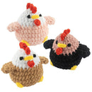 Three knitted chicken toys in different colors on a white background
