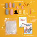 Collection of crochet supplies including yarn, hooks, and patterns on a yellow background