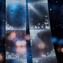 Decorative strip with stars, butterflies, and abstract designs on a dark background
