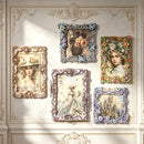 Five ornate vintage-style picture frames with floral and decorative borders are arranged on a cream-colored paneled wall. The frames contain various artistic prints, including portraits of women in hats, a floral arrangement, a girl with flowers in her hair, a woman in a white dress, and a castle scene.