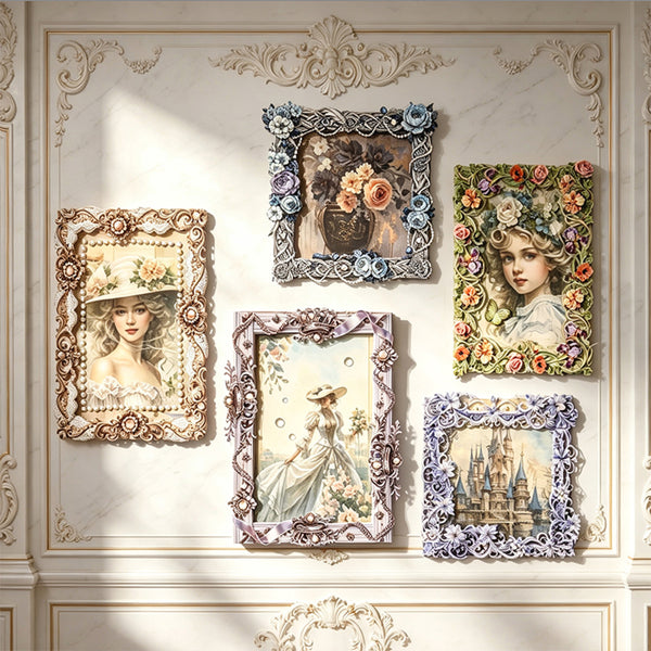 Five ornate vintage-style picture frames with floral and decorative borders are arranged on a cream-colored paneled wall. The frames contain various artistic prints, including portraits of women in hats, a floral arrangement, a girl with flowers in her hair, a woman in a white dress, and a castle scene.