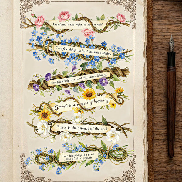 An open vintage-style book or journal page with decorative floral garlands and inspirational quotes, shown beside a wooden surface and a dark fountain pen.