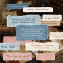 A collage of textured fabric labels in blue, cream, and pink, each printed with a friendship-themed quote or word, arranged over a blurred warm-toned background.