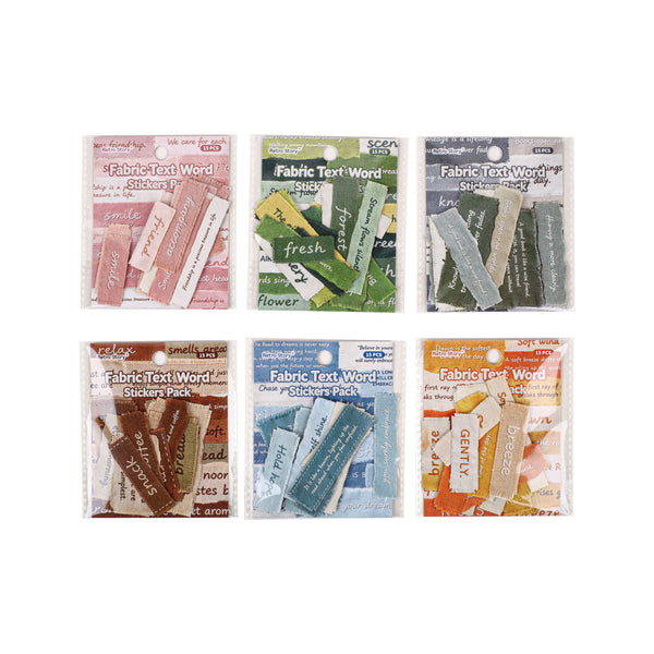 Six small packaged sticker packs arranged in a 2x3 grid on a white background. The packs contain fabric-textured word stickers in different colors including pink, green, gray, brown, blue, and orange.