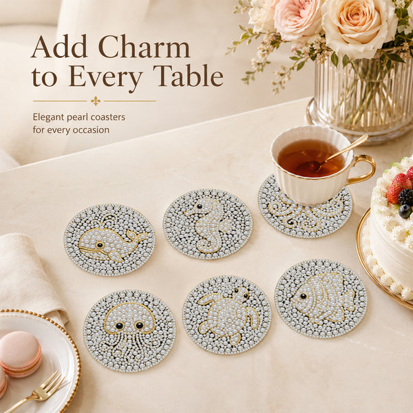 Six round pearl coasters with animal designs arranged on a beige table alongside a teacup, cake, macarons, and flowers. Text at the top reads 'Add Charm to Every Table'.