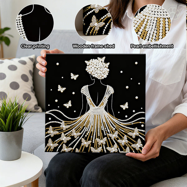 Person holding a decorative wall art piece with pearl embellishments and butterflies, surrounded by close-up details of the product.
