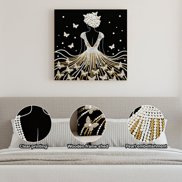 Decorative wall art of a woman in a dress with butterflies, displayed on a wall above a sofa.