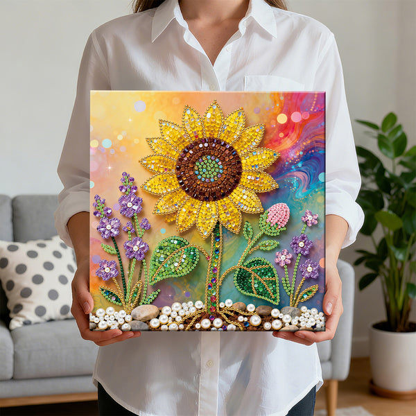Person holding a colorful diamond painting of a sunflower and flowers