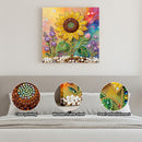 Decorative wall art with sunflower design on a gray wall, showing close-ups of clear printing, wooden frame shed, and pearl embellishment.