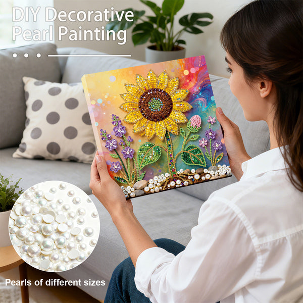 Woman holding a DIY decorative pearl painting with a sunflower design, surrounded by pearls of different sizes.