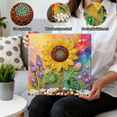 Person holding a diamond painting with various embellishment options shown above.