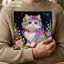 Person holding a colorful cat painting made with decorative pearls.