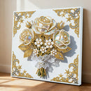 Decorative wall art with gold roses, pearls, and lace on a white background