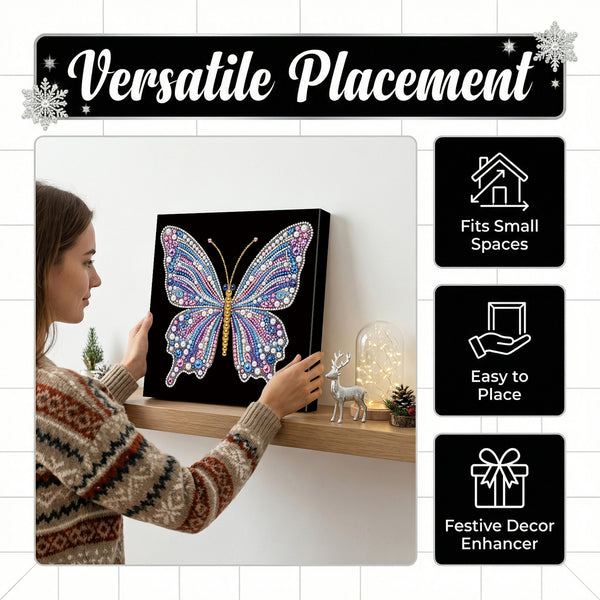 A woman in a patterned sweater hangs a square black canvas featuring a colorful butterfly design on a wooden shelf in a home setting. The image includes marketing text reading 'Versatile Placement' and feature icons stating 'Fits Small Spaces,' 'Easy to Place,' and 'Festive Decor Enhancer.