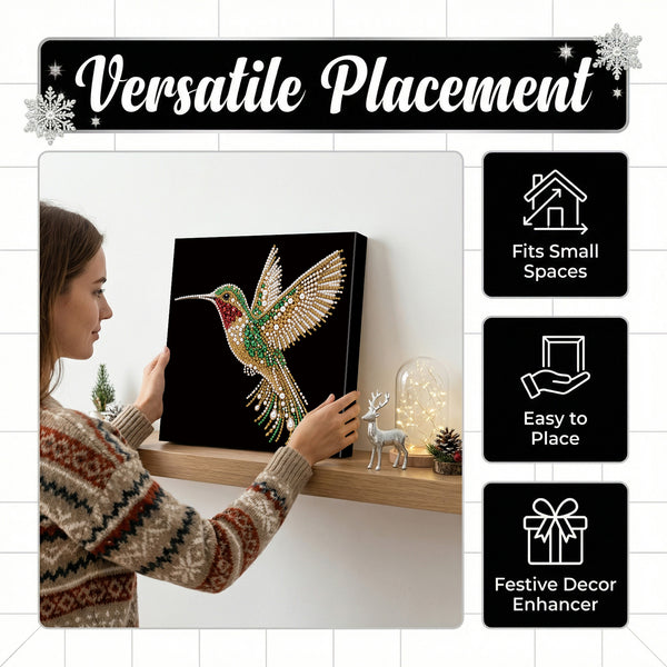 A woman in a patterned sweater is holding a black canvas wall art piece featuring a colorful jeweled hummingbird. The image includes marketing text reading 'Versatile Placement' and three black feature tiles stating 'Fits Small Spaces,' 'Easy to Place,' and 'Festive Decor Enhancer.