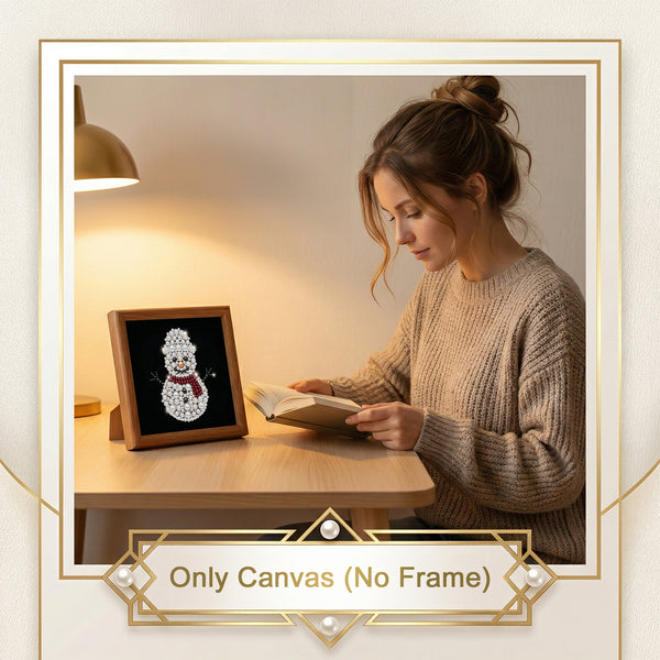 A woman sits at a wooden desk reading a book beside a small framed canvas display featuring a snowman design. The image includes a decorative border and the text 'Only Canvas (No Frame)', indicating the product is the canvas print rather than the frame.