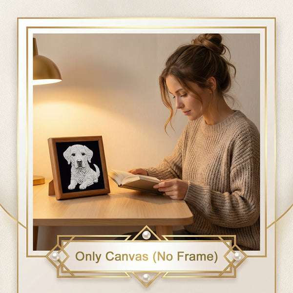 A woman sits at a wooden table reading a book beside a small canvas art piece of a white dog on a black background, with a warm lamp and decorative gold border framing the scene. Text at the bottom reads 'Only Canvas (No Frame)'.